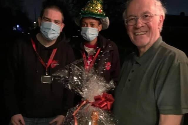 Lee and Lorraine pictured with one of the hamper recipients.