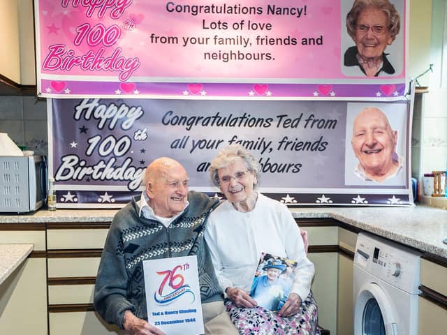 Ted and Nancy pictured cuddling in their kitchen with their celebratory cards. Pictures by Kirsty Edmonds.