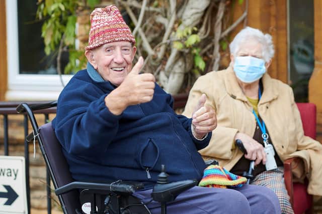 Thumbs up from St John's Residential Care Home residents after receiving their shoe boxes from Dunelm