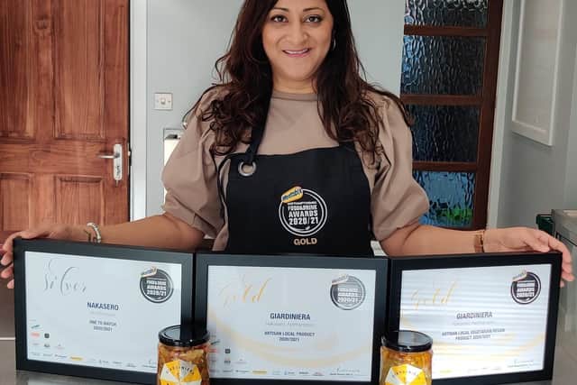Gita Raikundalia with her three Northamptonshire Food and Drink Awards and giardiniera
