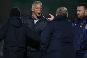 Keith Curle and Gillingham boss Steve Evans enjoy a first-half 'discussion' at the PTS Academy Stadium (Picture: Pete Norton)