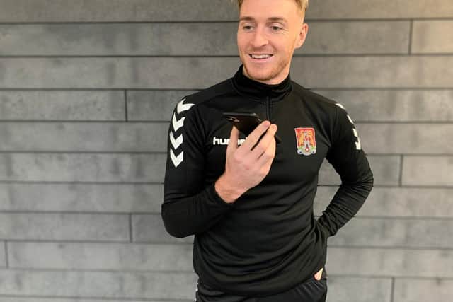 Northampton Town star Ryan Watson talks to a fan before Christmas