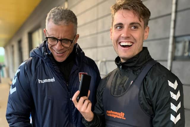 Northampton Town manager Keith Curle (left) and Danny Rose chat to a fan before Christmas