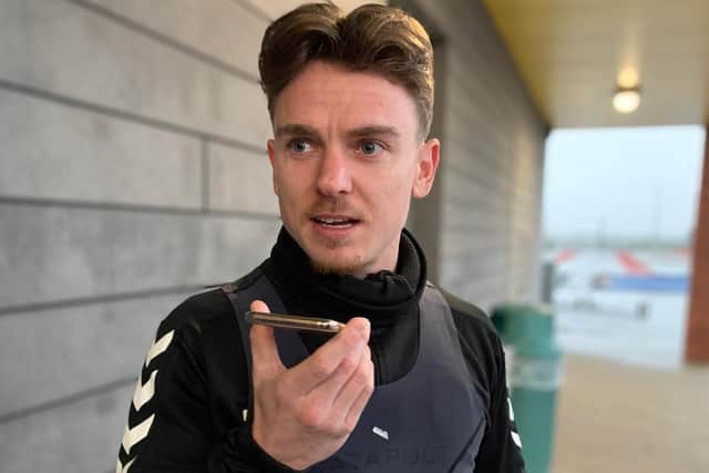 Northampton Town player Sam Hoskins talks to a fan before Christmas