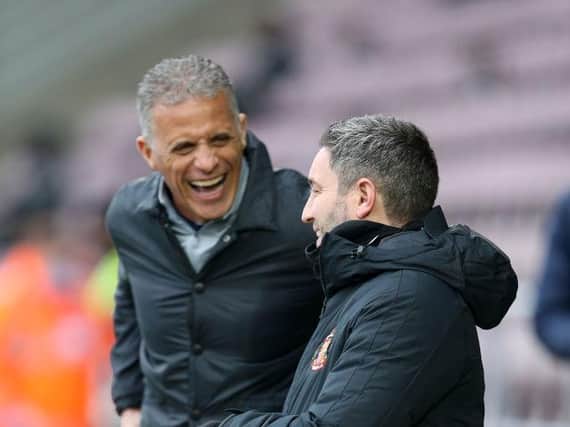 Keith Curle and Lee Johnson share a joke before kick-off. Picture: Getty.