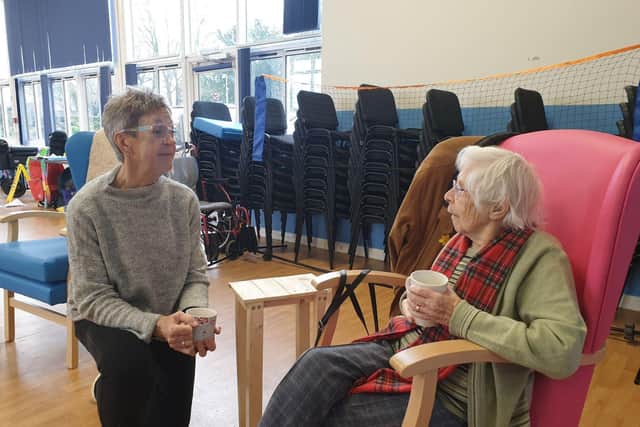 99-year-old Kay enjoying social interaction at the day centre.