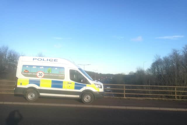 The van is parked on the bridge near Billing Aquadrome