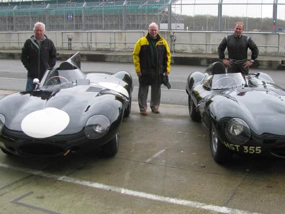 (L-R) Gary Pearson, his father John and his brother John with the restored Jaguar D-Type