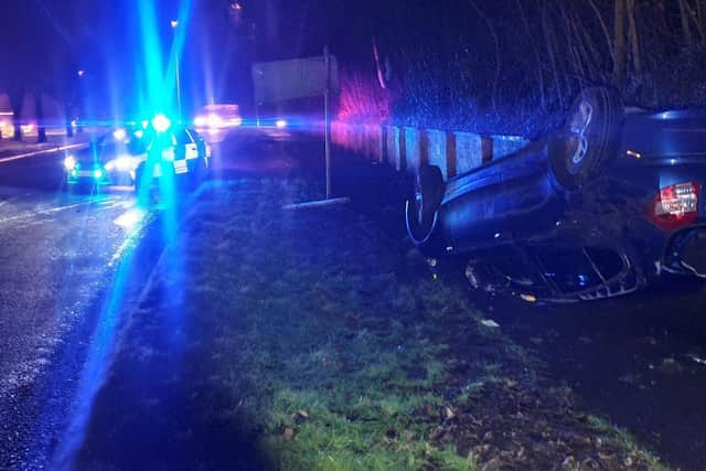 The BMW wound up on its roof in Corby last night. Photos: @NGInterceptors