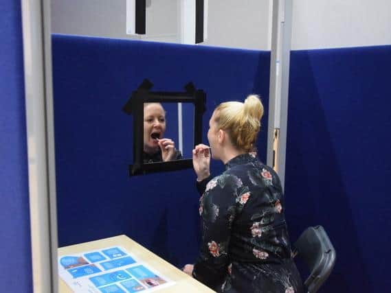 A member of staff taking an LFT