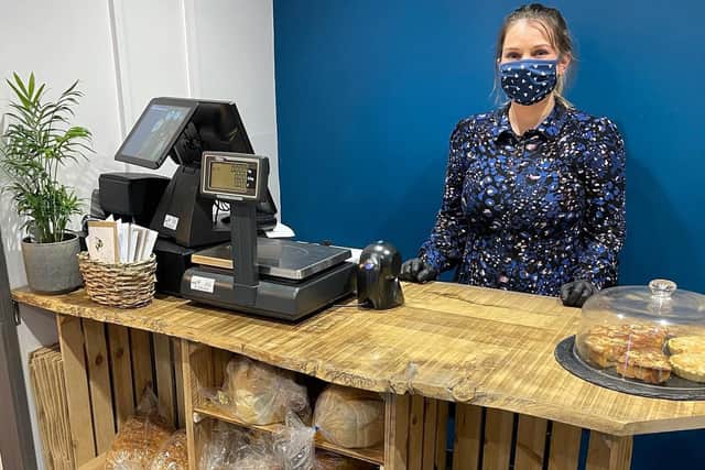 The Plough Barn Shop manager Ellie Collins behind the counter
