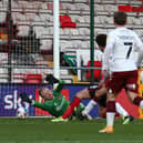 Jonathan Mitchell makes an excellent close-range save from Joe Walsh in the first-half of Saturday's League One fixture at Sincil Bank. Pictures: Pete Norton.