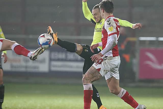 Joseph Mills battles for possession in the Cobblers' 0-0 draw at Fleetwood