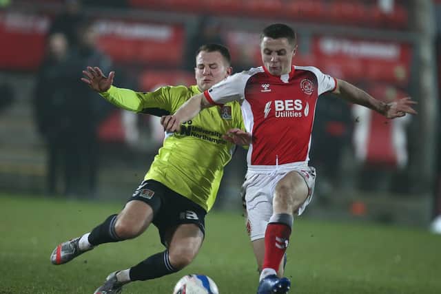 Midfielder Bryn Morris gets a tackle in during the Cobblers' 0-0 draw at Fleetwood