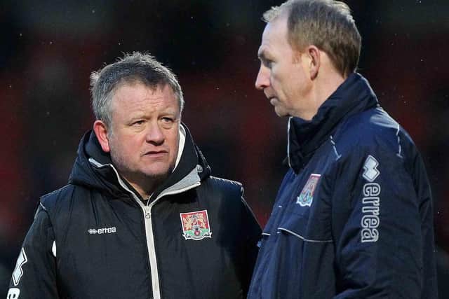 Cobblers boss Chris Wilder and assistant Alan Knill, pictured during their first game in charge - a 1-1 draw at Cheltenham Town (Picture: Sharon Lucey)