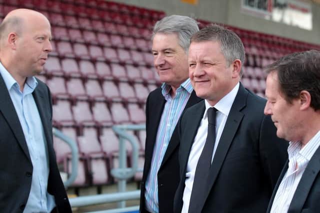 Chris Wilder pictured with (from left) chairman David Cardoza and directors Barry Hancock and David Jackson