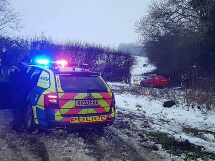 Police corner the crashed Audi in a field near Corby. Photo: @NGInterceptors