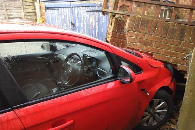 The red Vauxhall Corse went straight through the garden wall on Broadway East in Northampton