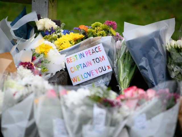 Flowers and tributes near Sir Tom's home at Marston Moretaine today
