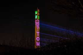 The National Lift Tower in Northampton lit up in memory of Captain Sir Tom Moore.