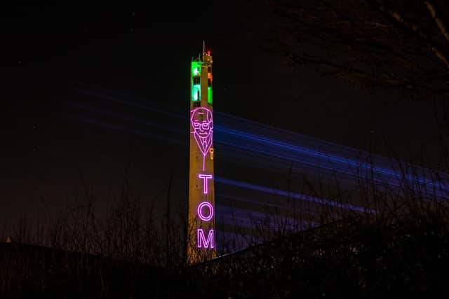 The National Lift Tower in Northampton lit up in memory of Captain Sir Tom Moore.