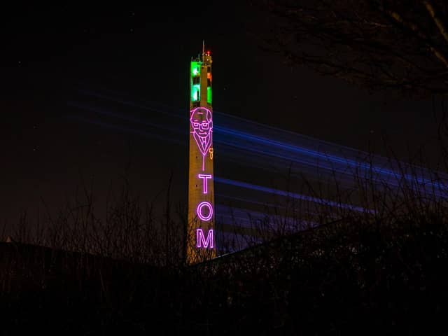 The National Lift Tower in Northampton lit up in memory of Captain Sir Tom Moore.