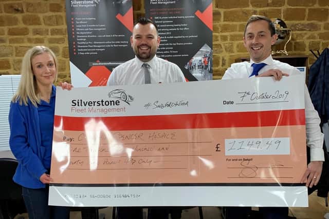 Nina Gandy, of Cynthia Spencer Hospice, with Ryan Bishop and Scott Norville, of Silverstone Fleet Management