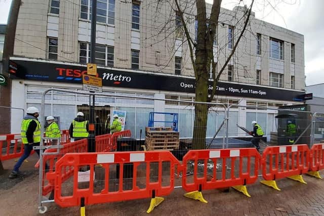 Workers on site at the former Tesco Metro store in Abington Street