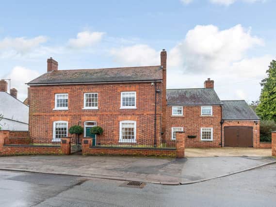 A red brick period family home which has a gravelled driveway that provides off-road parking and leads to a garage with power. A second gated gravelled driveway leads to a second garage with double doors, power and attached potting shed.