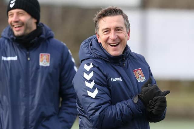 Jon Brady takes his first training session with assistant manager Marc Richards.