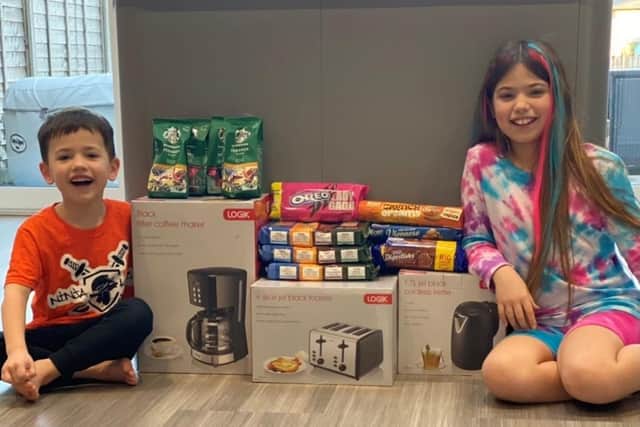 Kiki and Billy Loraine with their haul of gifts for Northampton General Hospital's labour ward, bought from money raised from their bracelet sale