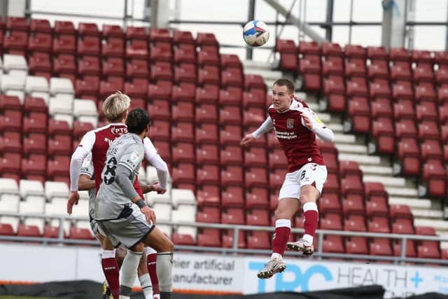 Bryn Morris rises to head the ball during the Cobblers' 2-0 loss to Burton Albion