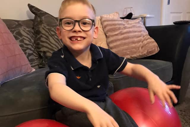 Jack Smith likes to bounce on the exercise balls he uses for physio and dreams of one day bouncing from his feet.
