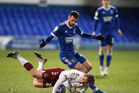 Danny Rose is left grounded after this clash with Ipswich's Troy Parrott (Pictures; Pete Norton)