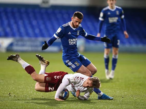 Danny Rose is left grounded after this clash with Ipswich's Troy Parrott (Pictures; Pete Norton)