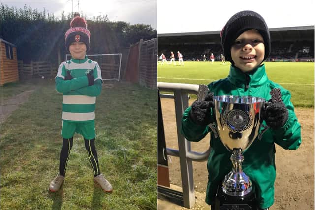 (Left): Josh reading to tackle his charity challenge and (right): with the trophy following an under 7s penalty tournament at Northampton Town in 2019.