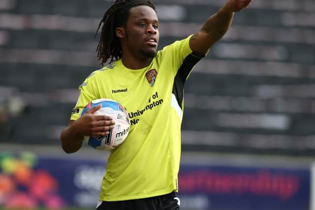 Peter Kioso prepares to take a long throw at MK Dons. Picture: Pete Norton.