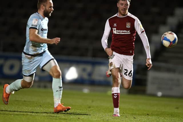Cobblers striker Ryan Edmondson on the chase in the clash with Rochdale