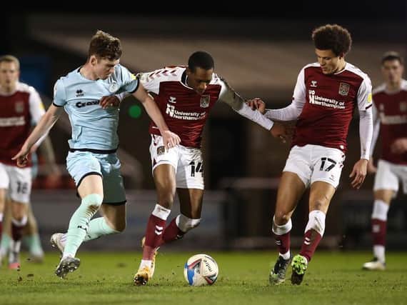 Mickel Miller on the ball for the Cobblers during their clash with Rochdale at the PTS on Tuesday (Pictures: Pete Norton)