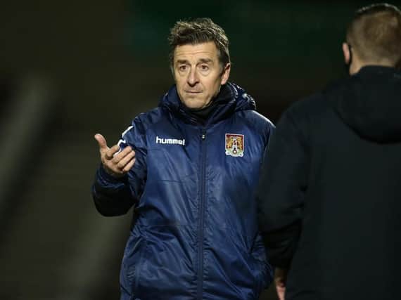 Jon Brady watches his Cobblers team draw 0-0 with Rochdale on Tuesday (Pictures: Pete Norton)