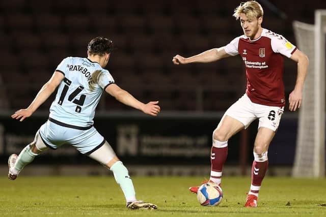 Ryan Watson on the attack for the Cobblers against Rochdale