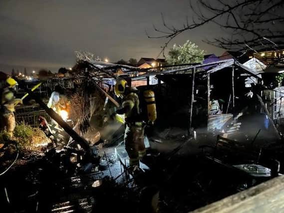 Firefighters tackle Tuesday night's blaze at an allotments in Kettering