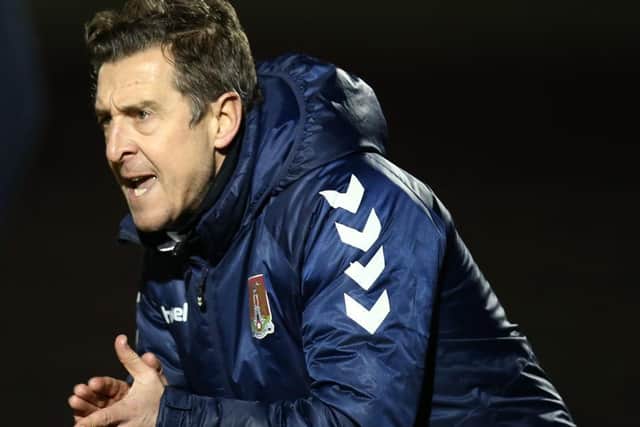 Jon Brady encourages his players from the touchline.