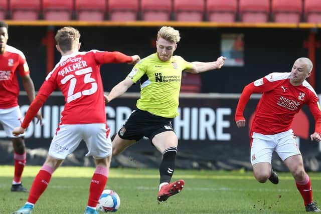Ryan Watson opens the scoring against Swindon Town with a fine first-half strike. Pictures: Pete Norton.