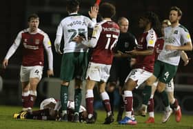Plymouth's Sam Woods was sent off for a poor challenge on Ricky Korboa in stoppage-time, but by then Cobblers had the points sewn up. Pictures: Pete Norton.