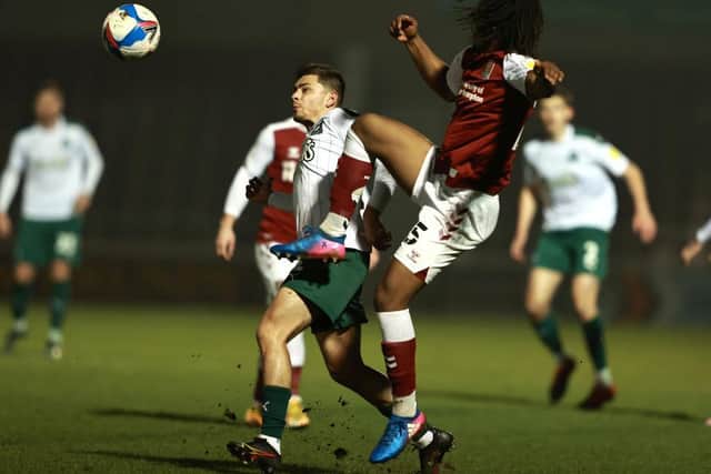 Peter Kioso clears the danger in the Cobblers' win over Plymouth