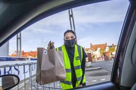 Food is delivered to customers' cars after orders are placed on an app. Photo: Kirsty Edmonds.