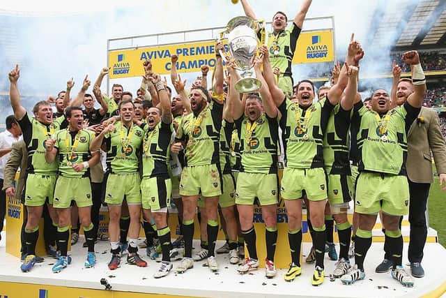 The Saints players celebrate after winning the Premiership title