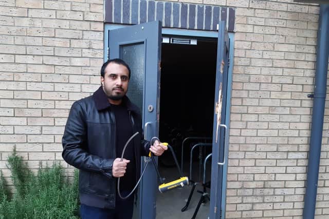 Tanvir outside the bike storage area with his snapped lock