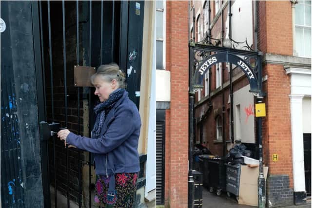 Sarah Matcham (left) - mother of Bradley Matcham who died after being punched in the alley - closing the newly installed gates.